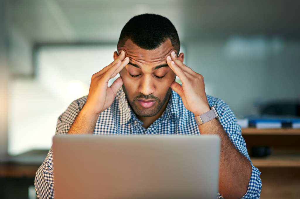 Stressed man on his laptop